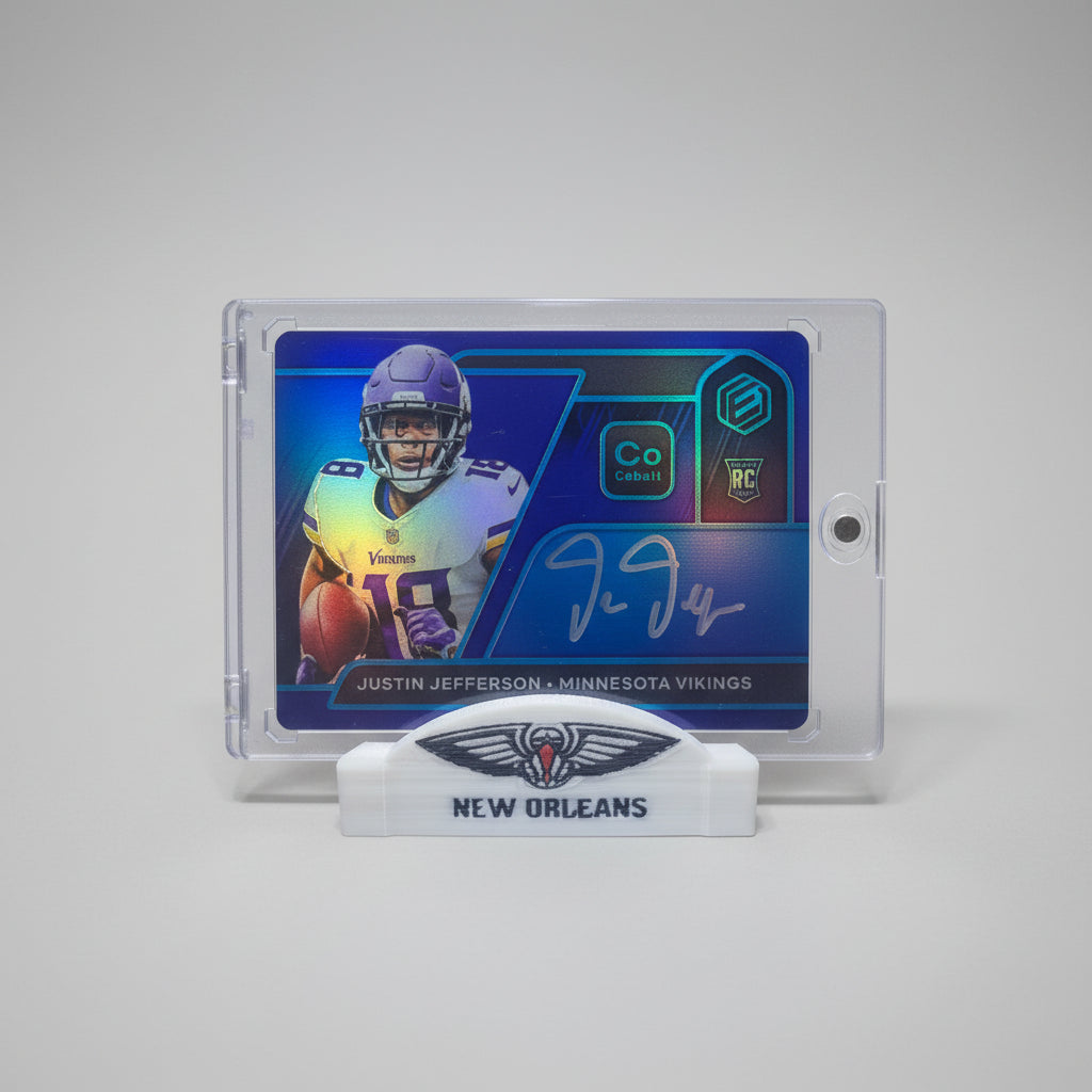 Collectible sports card featuring a player in a Minnesota Vikings uniform on a marble surface with a colorful background.