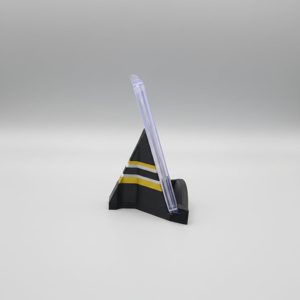 Model rocket on a marble surface with a laptop in the background