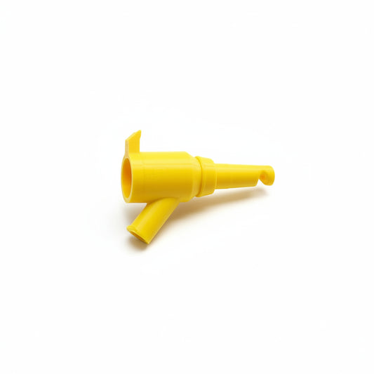 Yellow funnel-shaped object on a textured black surface