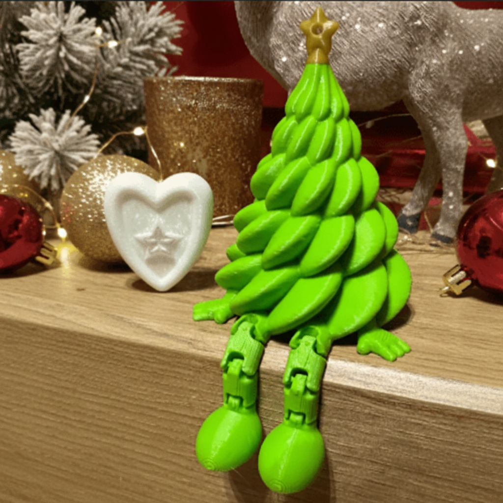 Green toy resembling a Christmas tree on a wooden surface