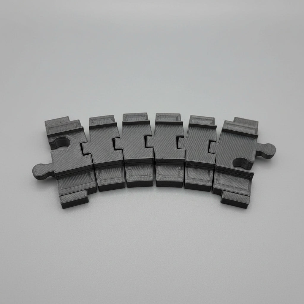 Black plastic component on a textured gray surface