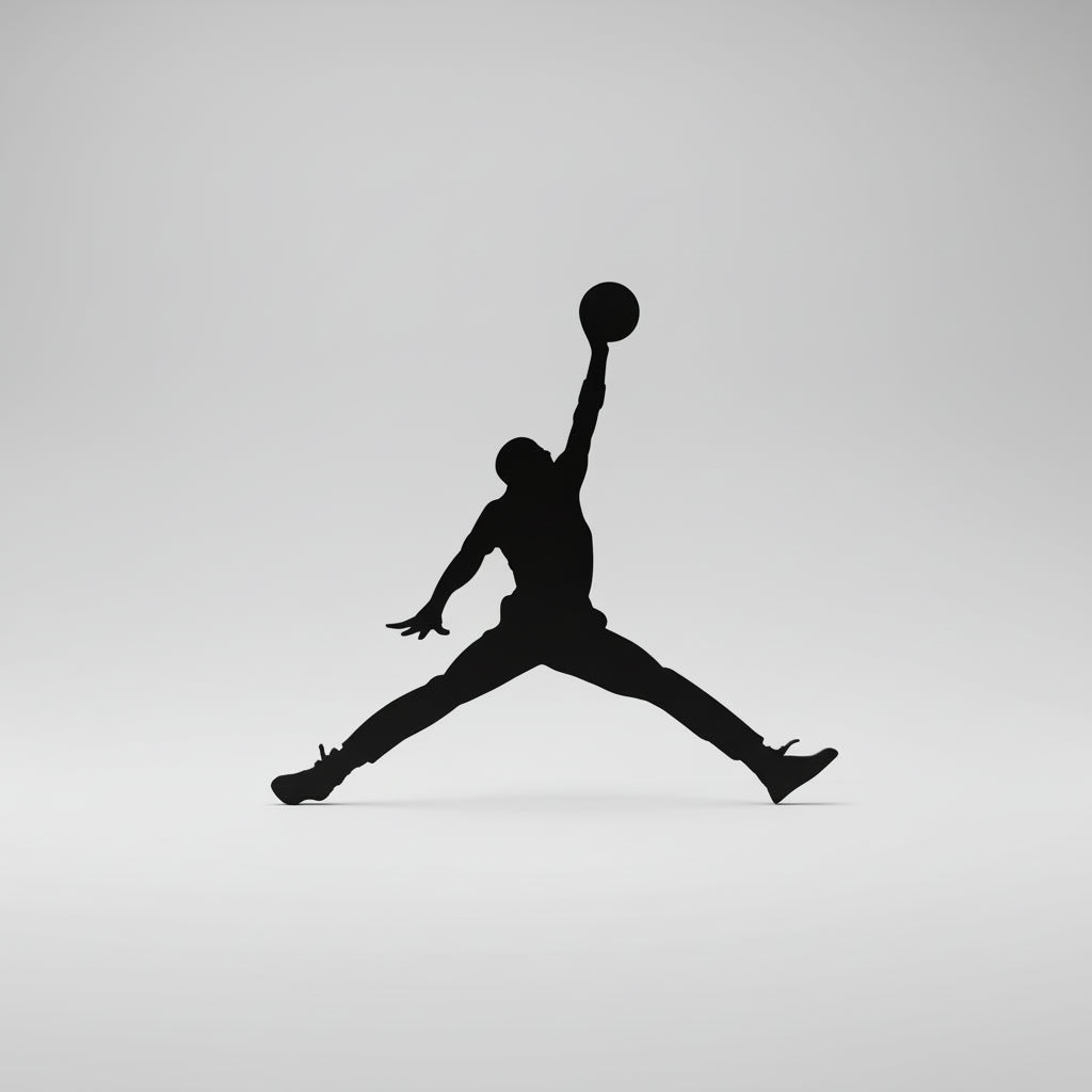 Black silhouette of a person in mid-air with a basketball, likely representing a famous athlete, on a white background.