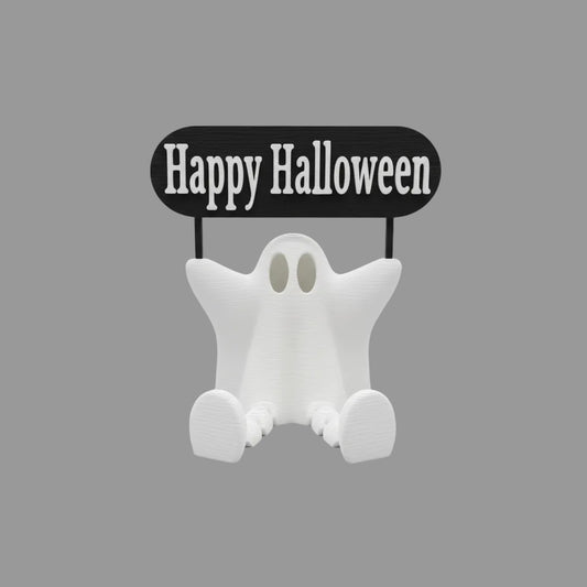 Ghost figurine with 'Happy Halloween' sign on a wooden surface