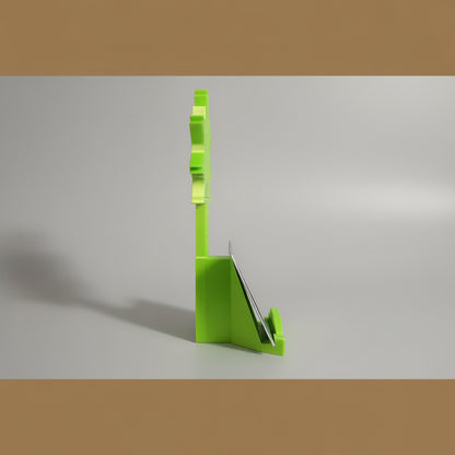 Green card holder with cards on a wooden surface
