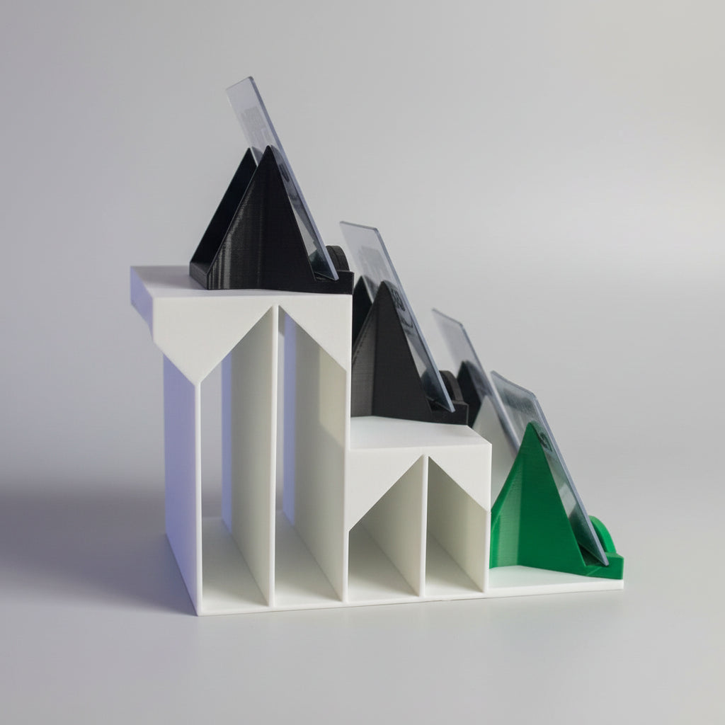 Model of a building with a dark roof and white base, set against a backdrop of sports trading cards.