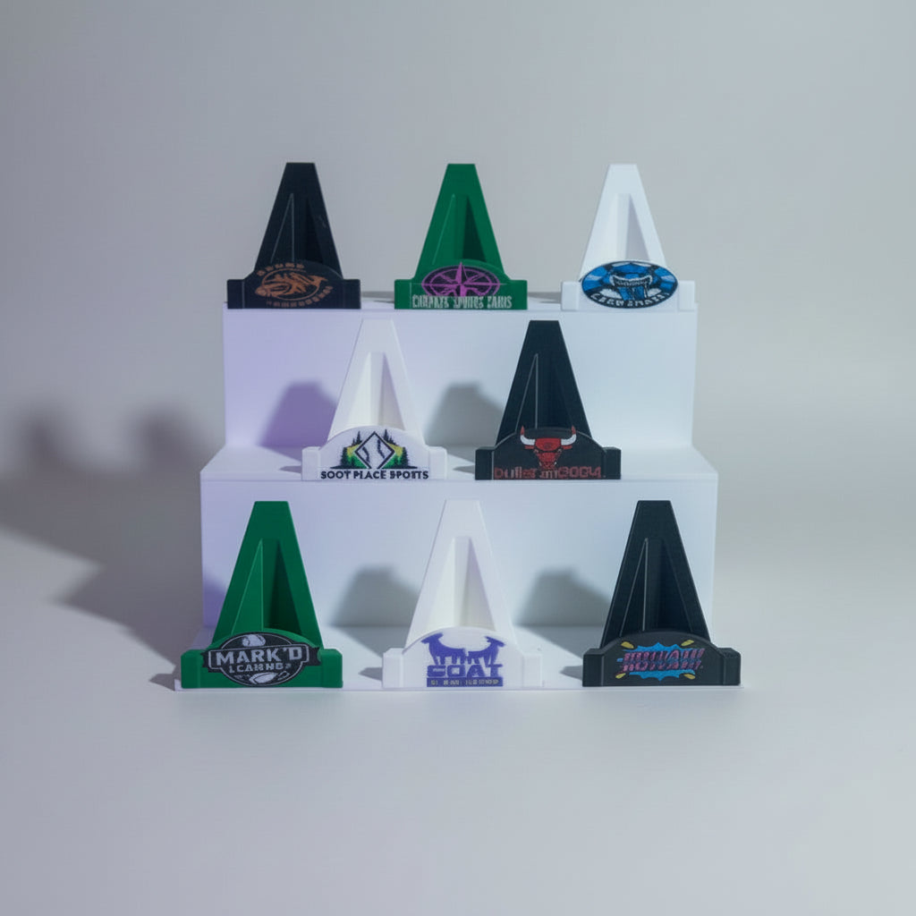 Collection of miniature sports cones with various designs on a white background