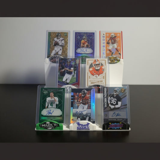 Collection of sports trading cards on a display stand with a background of more cards.