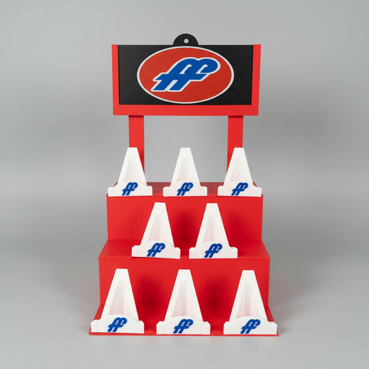 Red and white obstacle course with blue logo on a wooden floor