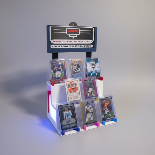 Collection of sports trading cards on a display stand with 'Whatcha Printing' branding.