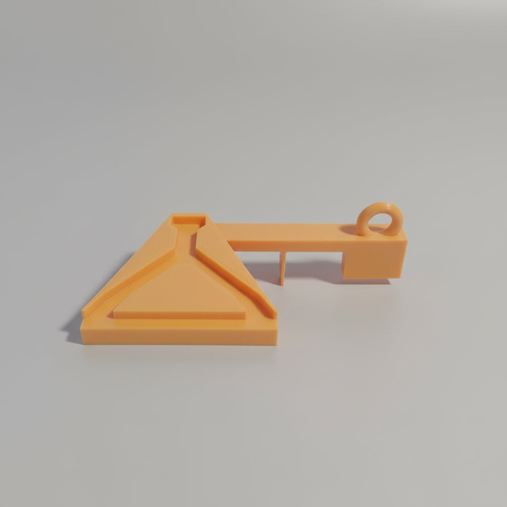 Orange plastic tool on a reflective surface with colorful light effects