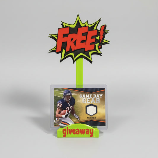 Football trading card with 'FREE giveaway' sign in front of other cards on a wooden surface.