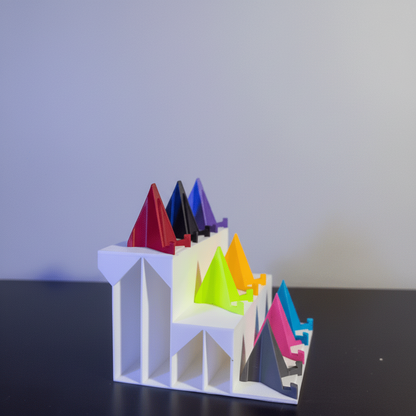 Colorful 3D printed model with a sign in front of a collection of trading cards