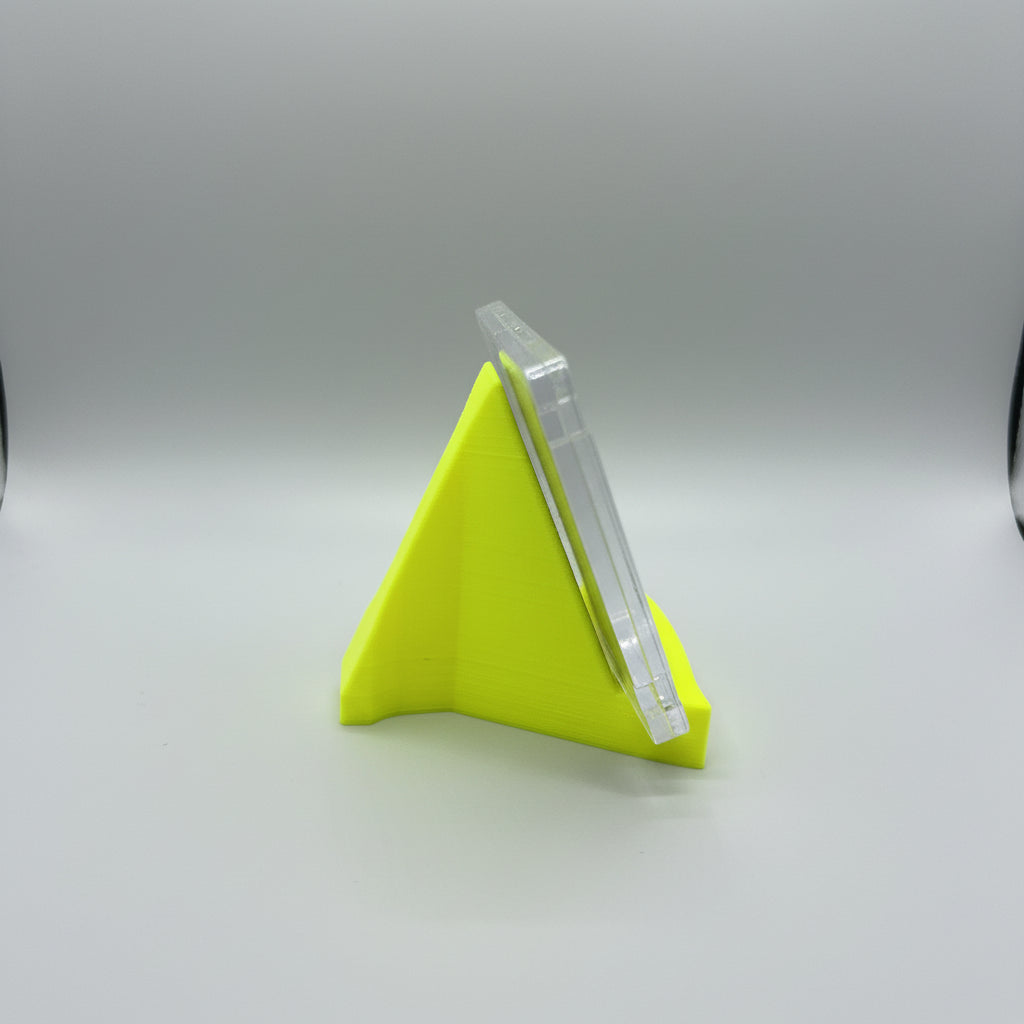 Small yellow funnel on a textured surface with a blurred background