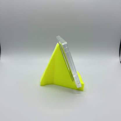 Small yellow funnel on a textured surface with a blurred background