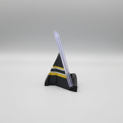 Model rocket on a marble surface with a laptop in the background