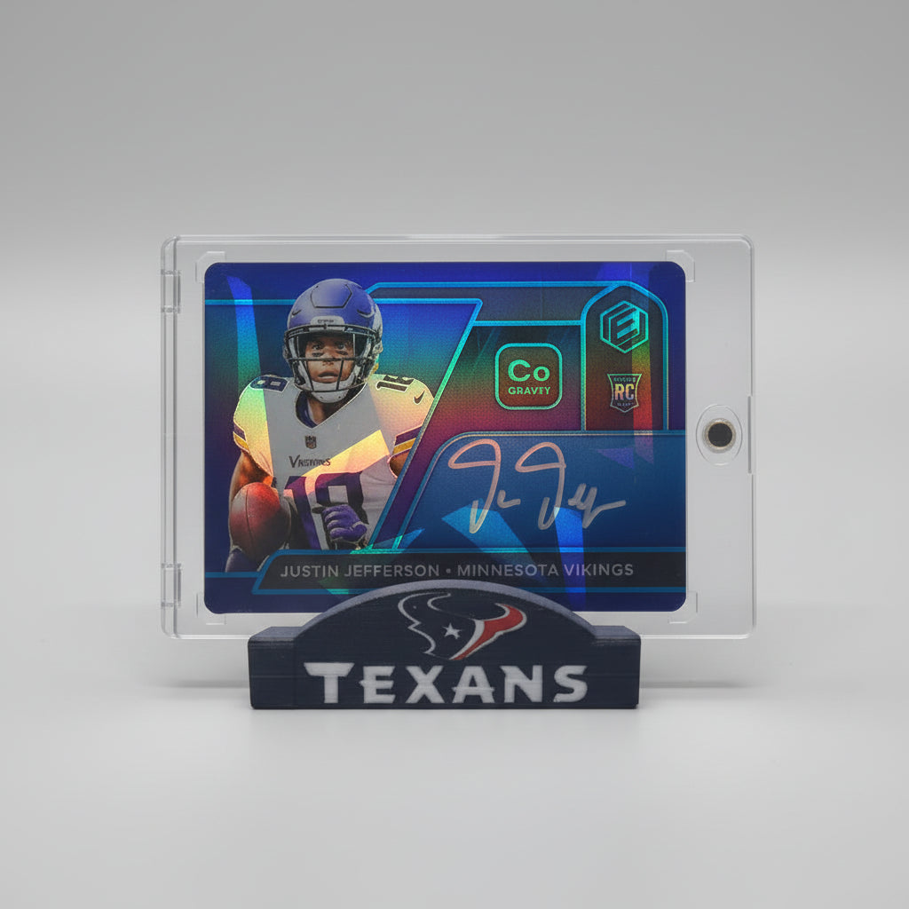 Collection of sports trading cards featuring football players on a marble surface with colorful lighting.