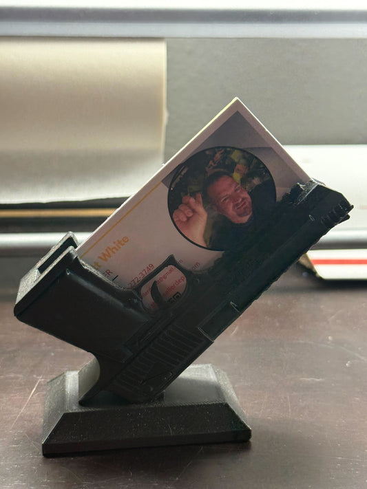 Black photo holder with a printed photo on a metallic surface
