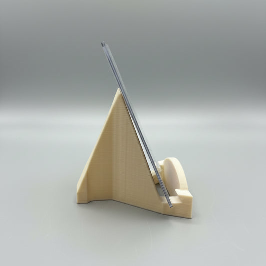 Clear plastic ruler on a beige stand against a blurred background