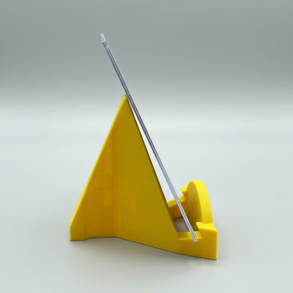 Yellow window cleaning squeegee on a metallic surface