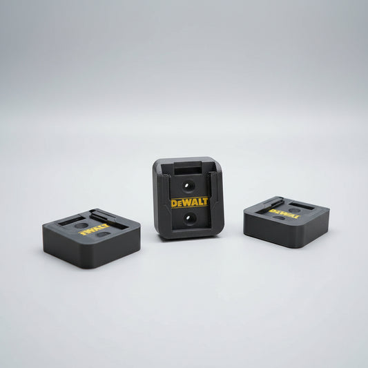 DeWalt battery chargers on a wooden surface with DeWalt power tools in the background.