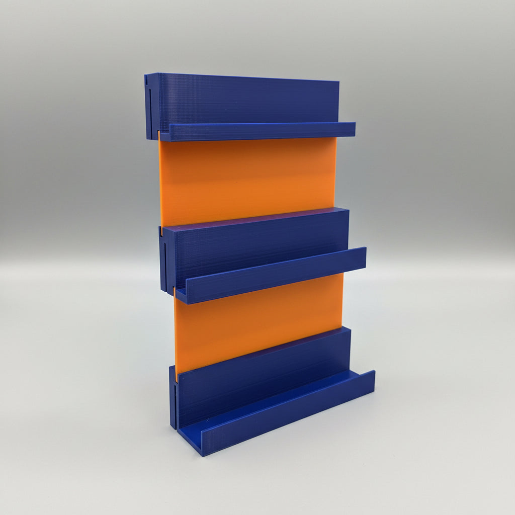 Blue plastic tool with orange accents on a dark surface