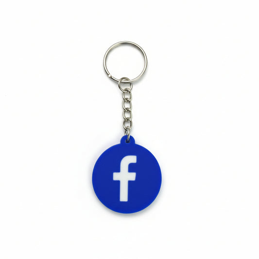 Keychain with Facebook logo on a dark textured background