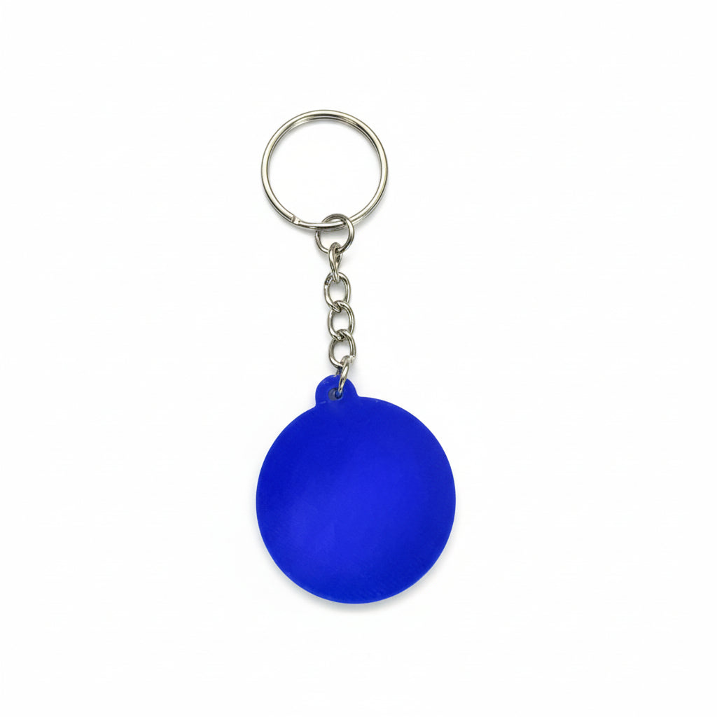 Blue keychain on a carbon fiber background