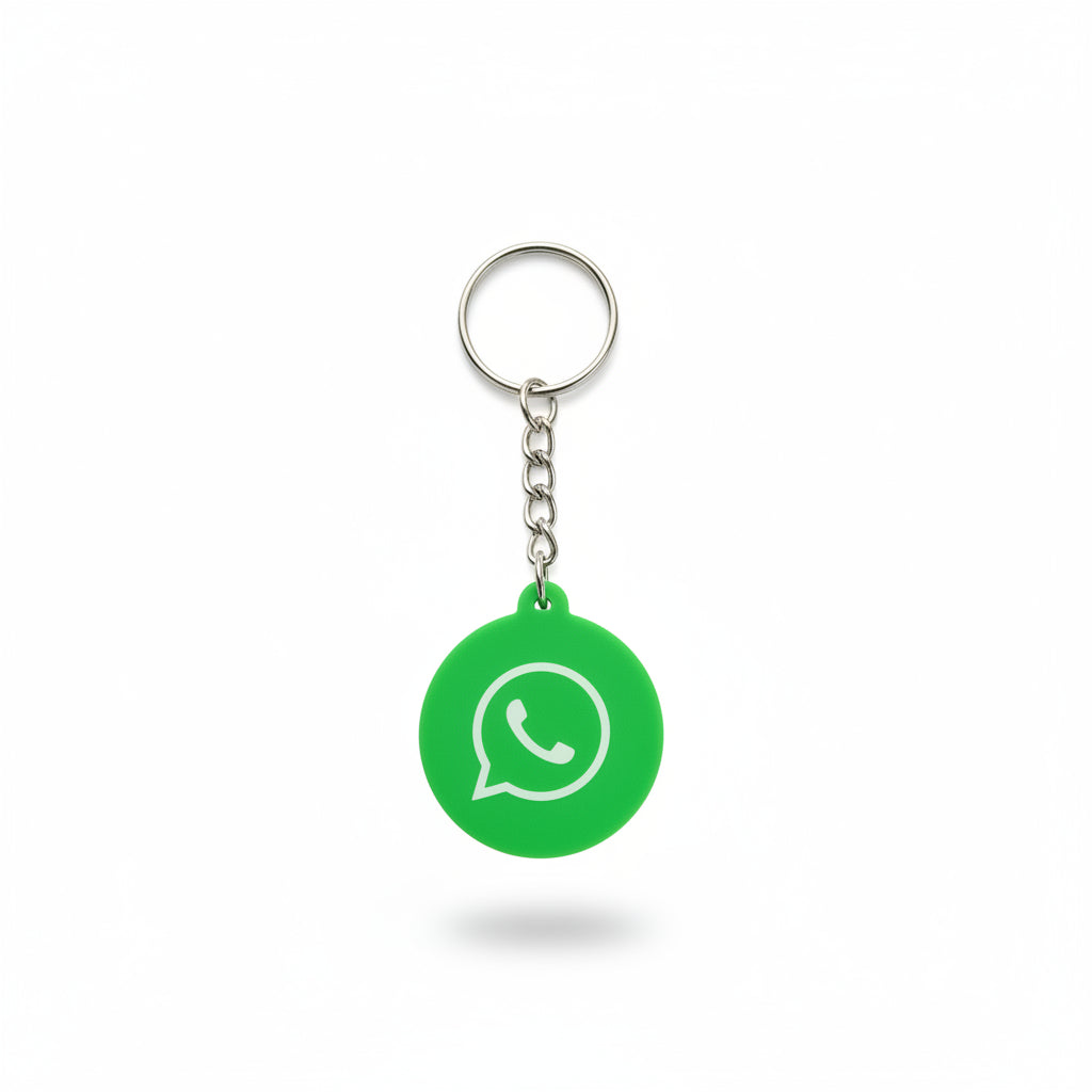 Green keychain with WhatsApp logo on a dark textured background