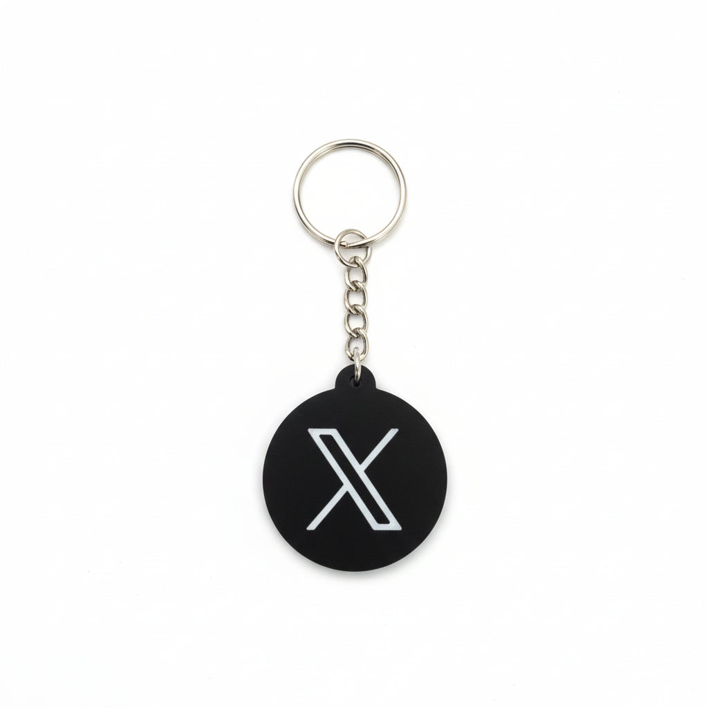 Keychain with a white 'X' symbol on a black background