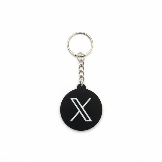 Keychain with a white 'X' symbol on a black background
