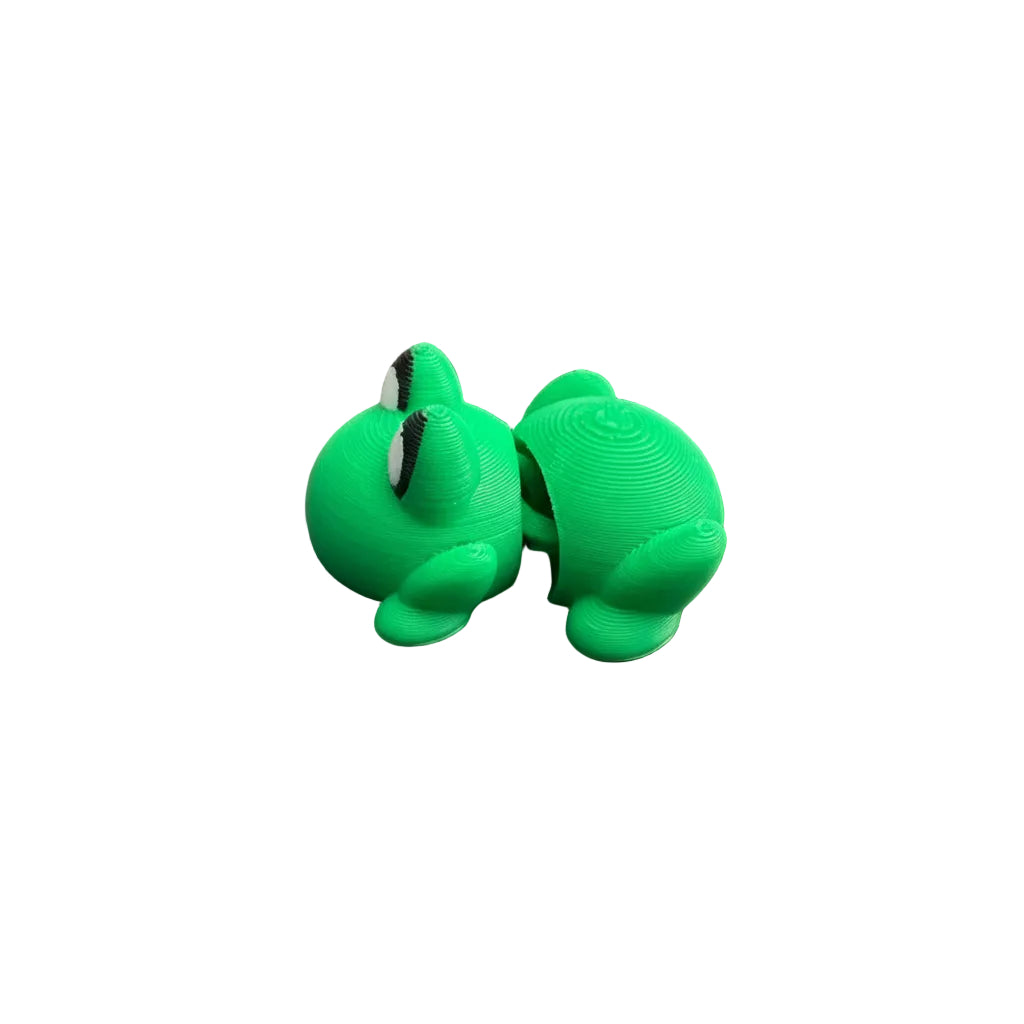 Two green turtle figurines on a wooden surface