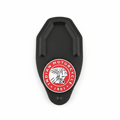 Black metal clip with Indian Motorcycle logo on a carbon fiber background
