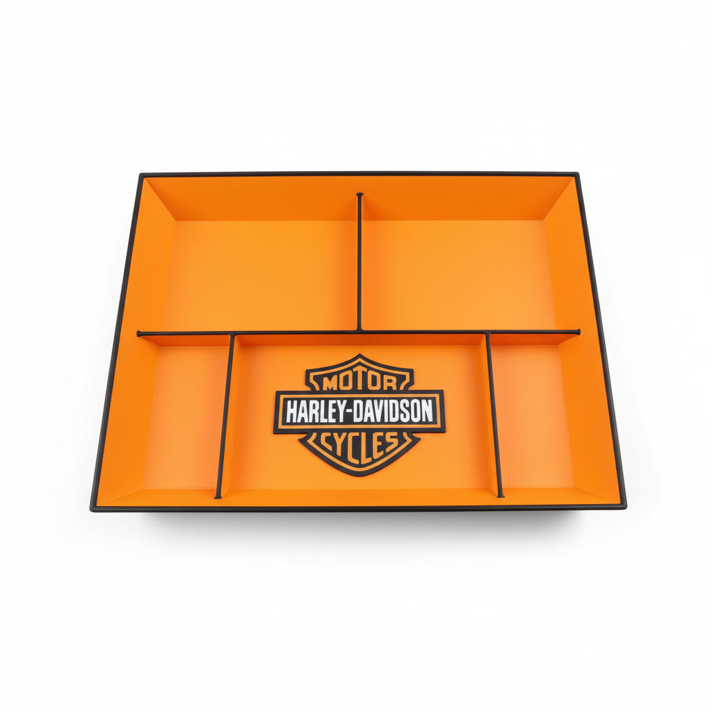 Orange tray with Harley-Davidson logo on a black surface