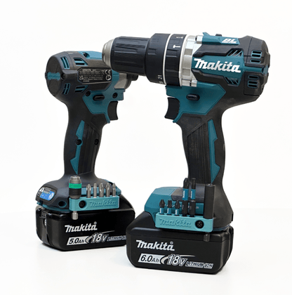 Two Makita cordless drills with batteries on a white background