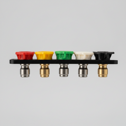 Set of colorful nozzles held by a hand against a neutral background