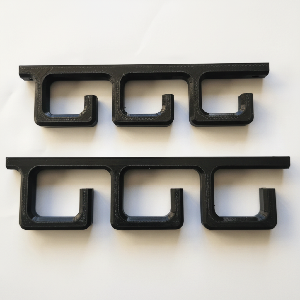 Black metal brackets on a white background