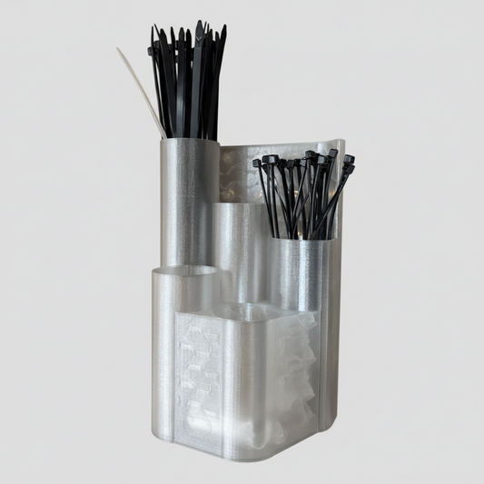 Clear plastic container with black straws on a pegboard wall