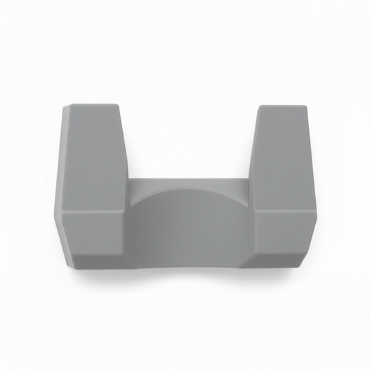 Wooden shovel leaning against a white wall with a red tool box and gray hook visible.