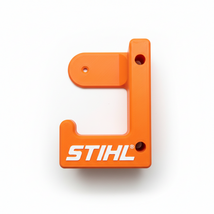 Orange metal bracket with 'STIHL' branding on a white background
