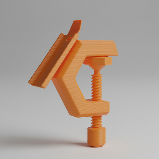 Orange C-clamp on a gray background