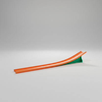 Orange and green slide on a beige floor with large windows in the background