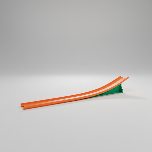 Orange and green slide on a beige floor with large windows in the background