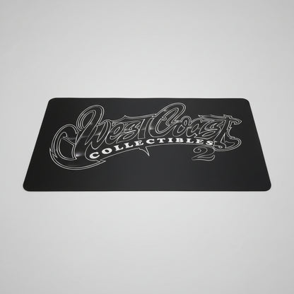 Black card with 'West Coast Collectibles' logo on a textured surface
