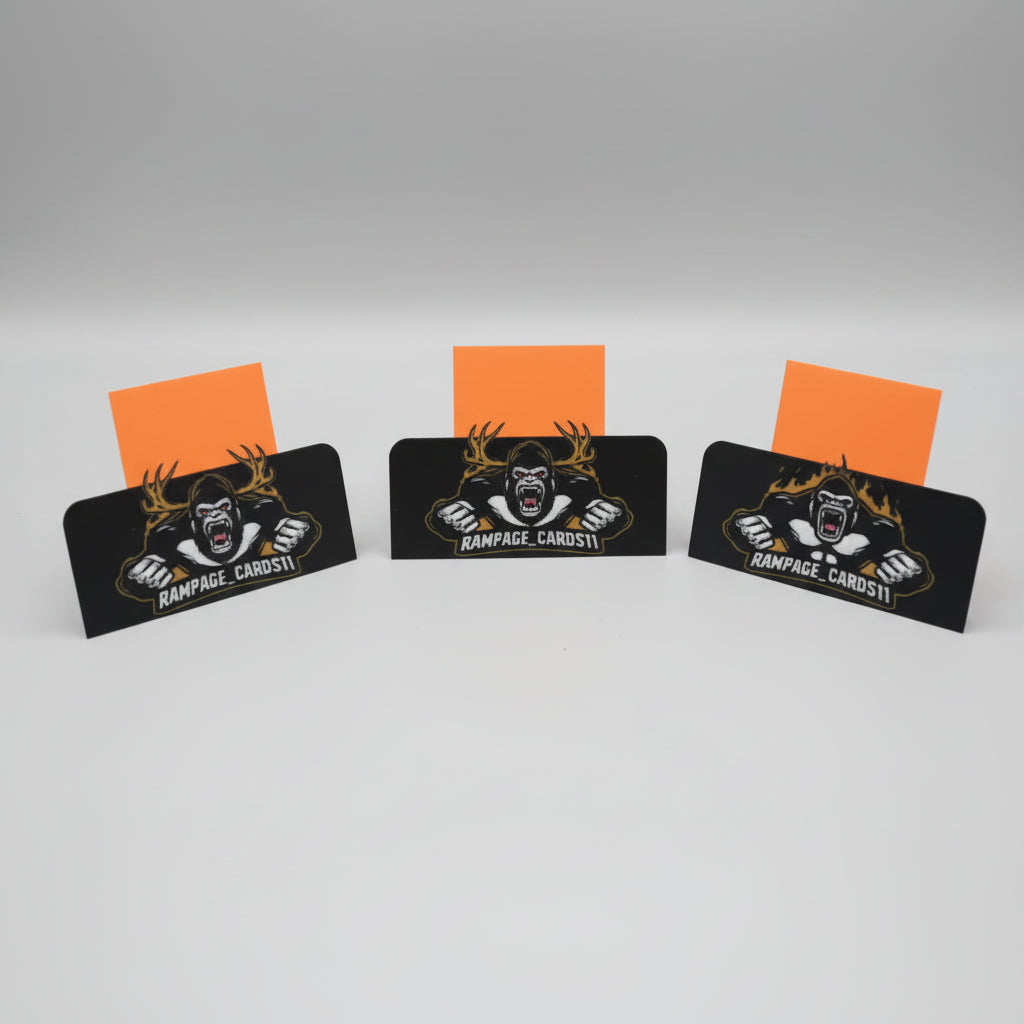 Collection of sports card holders with branding on a table.