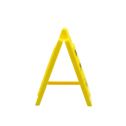 Yellow safety triangle on a reflective surface