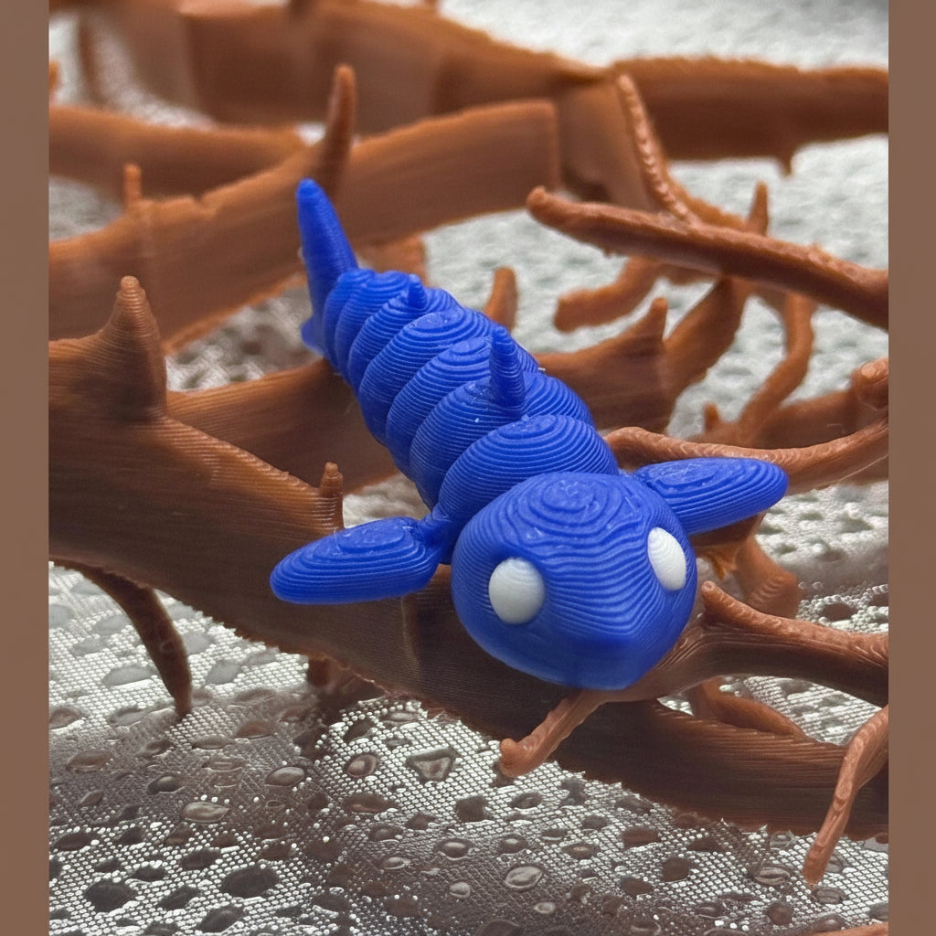 Blue 3D-printed creature on brown coral-like structure
