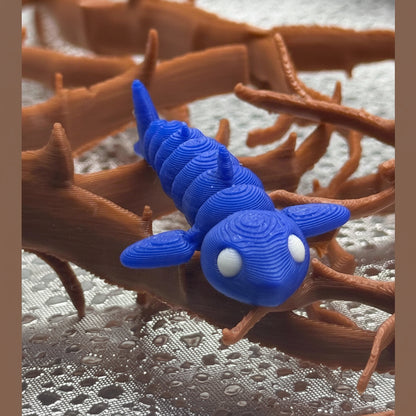Blue 3D-printed creature on brown coral-like structure