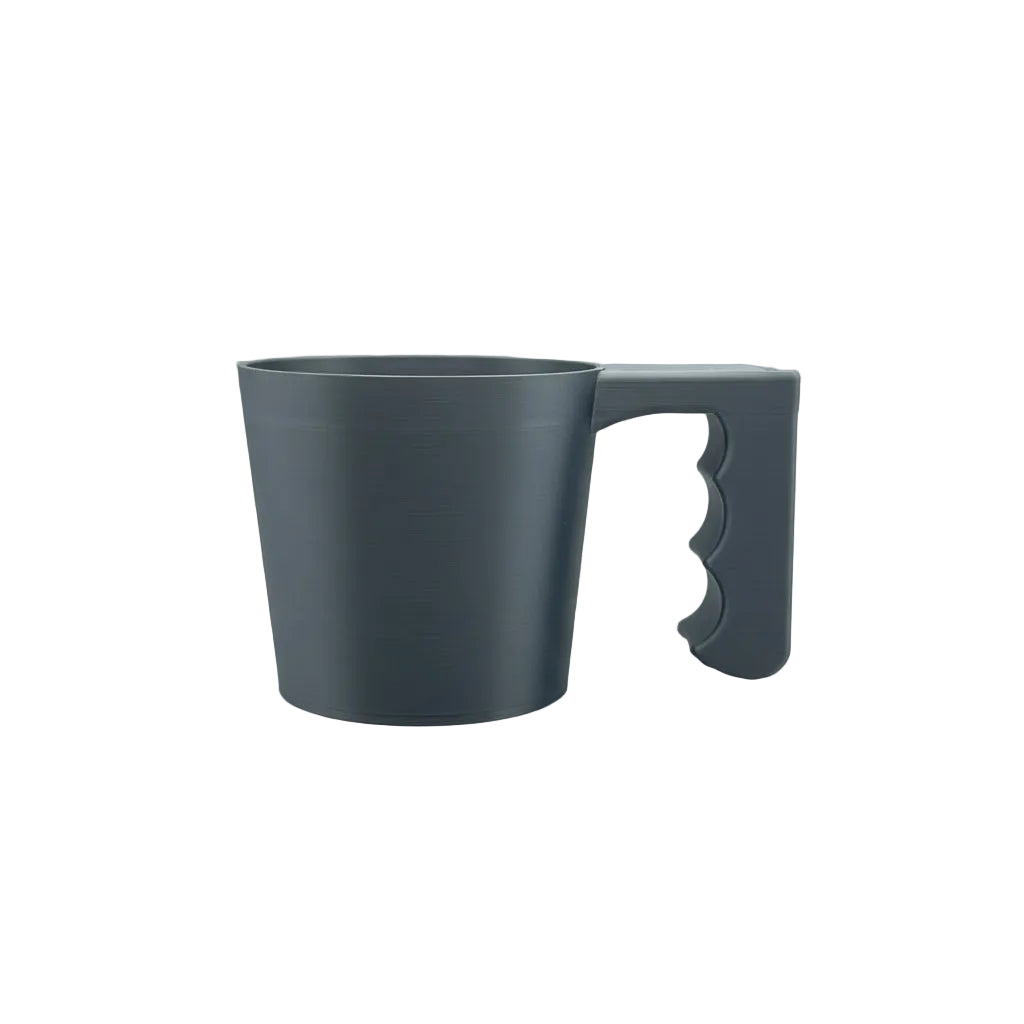Gray mug on a textured surface with a blurred background