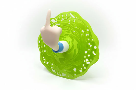 Green silicone mat with a hand-shaped handle on a textured gray background