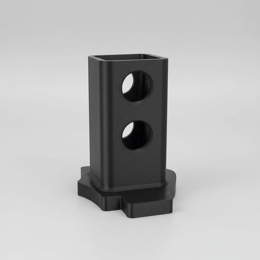 Black pencil holder on a wooden surface